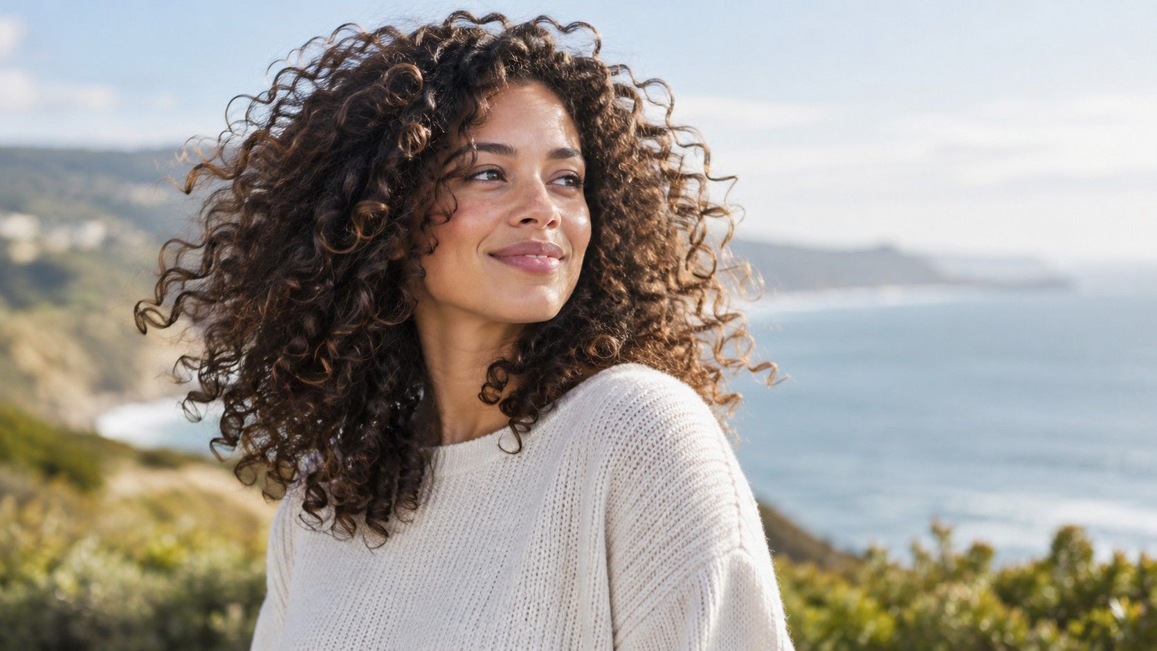 Curly haircut with soft layers